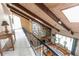 Stunning living room with vaulted ceilings, exposed beams, skylights and floor to ceiling stone fireplace at 1511 Womack Rd, Atlanta, GA 30338