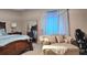 Comfortable main bedroom with stylish furniture, serene decor, and a relaxing ambiance at 227 Happy Trl, Locust Grove, GA 30248