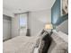 Main bedroom showcasing neutral walls, grey bedding and natural light from the window at 3081 Greyton Dr, Buford, GA 30519