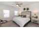 This main bedroom is bright, spacious, and features neutral decor with a ceiling fan at 542 Healy Dr # 52, Cumming, GA 30040