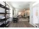 Inviting living area with a view into the dining room, featuring ample seating and natural light at 542 Healy Dr # 52, Cumming, GA 30040