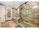 Luxurious bathroom features a walk-in shower and soaking tub with stone tile and modern fixtures at 2233 Peachtree Ne Rd # 1202, Atlanta, GA 30309