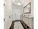 A lovely home entrance with dark wood floors, a white front door, and decorative table at 2233 Peachtree Ne Rd # 1202, Atlanta, GA 30309