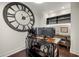 Office room with an oversized clock, hardwood floors, and built-in shelving at 2233 Peachtree Ne Rd # 1202, Atlanta, GA 30309