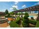 Outdoor pool area features a fire pit, cabana, and lush landscaping, creating a resort-like ambiance at 2233 Peachtree Ne Rd # 1202, Atlanta, GA 30309