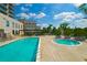 Resort-style pool and hot tub area with lounge chairs and a pergola offer the perfect place to relax at 2233 Peachtree Ne Rd # 1202, Atlanta, GA 30309