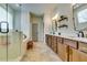 Elegant bathroom with double vanity, a glass-enclosed shower, and stylish hexagonal tile flooring at 4750 Fields Bridge Rd, Cumming, GA 30028