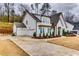 Charming home featuring a three-car garage and well-maintained lawn at 4750 Fields Bridge Rd, Cumming, GA 30028