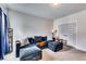 Comfortable living room featuring a plush sectional sofa, soft carpet, and natural light from the window at 4750 Fields Bridge Rd, Cumming, GA 30028