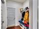 Cozy mudroom with built in storage bench and shelving perfect for shoes, coats, and organizing at 4750 Fields Bridge Rd, Cumming, GA 30028