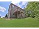 The backyard has a spacious lawn with a view of the raised wooden deck attached to the back of the home at 48 Scenic Ovlk, Acworth, GA 30101