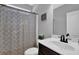Neutral bathroom featuring a sink, toilet, and shower with patterned shower curtain at 48 Scenic Ovlk, Acworth, GA 30101