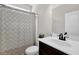 Bright bathroom featuring vanity, toilet and shower with patterned shower curtain at 48 Scenic Ovlk, Acworth, GA 30101