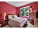 Cozy bedroom featuring a queen-sized bed, a large window with natural light, and wooden furniture at 48 Scenic Ovlk, Acworth, GA 30101