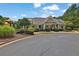 Community clubhouse with outdoor seating, a playground, and well-manicured landscaping at 48 Scenic Ovlk, Acworth, GA 30101