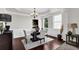 Formal dining room with wainscoting, decorative lighting, and a large window at 48 Scenic Ovlk, Acworth, GA 30101