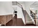 A staircase, hardwood floors and decorative furnishings define the stylish home foyer at 48 Scenic Ovlk, Acworth, GA 30101