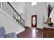 Elegant foyer with soaring ceilings, hardwood floors, staircase with iron railing, and plenty of natural light at 48 Scenic Ovlk, Acworth, GA 30101