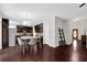 Modern kitchen featuring dark wood cabinets, stainless steel appliances, and an adjacent entry way at 48 Scenic Ovlk, Acworth, GA 30101
