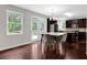Bright kitchen with dark wood cabinets, stainless steel appliances, and a center island with deck access at 48 Scenic Ovlk, Acworth, GA 30101