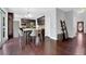 Bright eat-in kitchen with stainless appliances, dark cabinetry, hardwood floors, and a chandelier at 48 Scenic Ovlk, Acworth, GA 30101