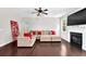 Bright living room with fireplace and backyard view, furnished with a comfortable sectional sofa at 48 Scenic Ovlk, Acworth, GA 30101