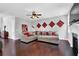 A stylish living room with a fireplace, modern lighting and dark wood flooring at 48 Scenic Ovlk, Acworth, GA 30101