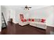 Spacious living room with a large sectional sofa and views through multiple windows at 48 Scenic Ovlk, Acworth, GA 30101