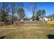 Large backyard with a privacy fence that backs to other residences at 906 Little Bear Cove Ne, Conyers, GA 30012