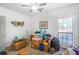 Bright bedroom with a ceiling fan and natural light with clutter at 906 Little Bear Cove Ne, Conyers, GA 30012