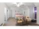 Spacious bedroom with vaulted ceiling and carpeted flooring, lit by a ceiling fan at 906 Little Bear Cove Ne, Conyers, GA 30012