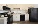 Functional kitchen with black appliances and ample cabinet storage at 906 Little Bear Cove Ne, Conyers, GA 30012