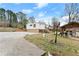 Large backyard showcasing the home's exterior and outdoor cooking area, plus a detached garage at 1164 Sandtown Sw Rd, Marietta, GA 30008