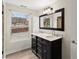 Beautiful bathroom featuring dual sinks, granite countertops, and a spacious window at 1164 Sandtown Sw Rd, Marietta, GA 30008