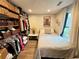 Cozy bedroom featuring a closet with basket storage, a large window, and neutral decor at 1164 Sandtown Sw Rd, Marietta, GA 30008