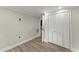 Bedroom with hardwood floors, a closet, and neutral walls at 1164 Sandtown Sw Rd, Marietta, GA 30008