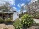 Landscaped front yard featuring a well maintained lawn and flowering trees next to the home's exterior at 1164 Sandtown Sw Rd, Marietta, GA 30008