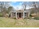 Charming stone-clad cottage with a welcoming front yard and quaint pathway at 1164 Sandtown Sw Rd, Marietta, GA 30008