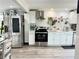 Updated kitchen featuring stainless steel appliances, white cabinets, and modern fixtures at 1164 Sandtown Sw Rd, Marietta, GA 30008