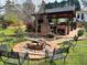 Outdoor space featuring a fire pit and an outdoor kitchen with a bar for gatherings at 1164 Sandtown Sw Rd, Marietta, GA 30008