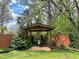 Charming pergola space with a tile floor, perfect for outdoor seating and relaxation at 1164 Sandtown Sw Rd, Marietta, GA 30008