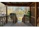 Back porch leads to expansive backyard with mature trees at 1395 W Booth Road Sw Ext, Marietta, GA 30008