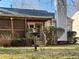 A charming backyard featuring a water fountain, screened-in porch and lush plantings at 1395 W Booth Road Sw Ext, Marietta, GA 30008