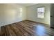 Cozy bedroom with wood floors and a window, perfect for relaxation at 1395 W Booth Road Sw Ext, Marietta, GA 30008