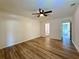 Bedroom with new floors and ceiling fan, adjacent to hallway and bathroom at 1395 W Booth Road Sw Ext, Marietta, GA 30008