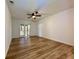 Bedroom with new floors, ceiling fan, and sliding doors to a covered patio at 1395 W Booth Road Sw Ext, Marietta, GA 30008