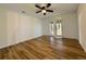 Bedroom with new floors, ceiling fan, and sliding doors to a covered patio at 1395 W Booth Road Sw Ext, Marietta, GA 30008