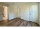 Empty bedroom with wood floors and two large white closets at 1395 W Booth Road Sw Ext, Marietta, GA 30008