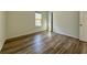 Comfortable bedroom featuring wood floors and a window with natural light at 1395 W Booth Road Sw Ext, Marietta, GA 30008