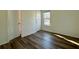 Bright bedroom with wood floors and a window offering natural light at 1395 W Booth Road Sw Ext, Marietta, GA 30008